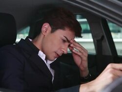 HD:Frustrated businessman drives a car Stock Footage