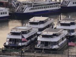 Docked Ferries sit in the harbor in Weehawken Stock Footage