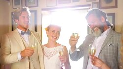 Family toasting bride and groom with champagne Stock Footage