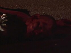 CU PAN Shot of dead body on streets AUDIO / Ciudad Juarez, Juarez, Mexico Stock Footage