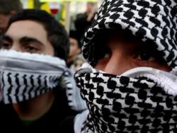 January 23, 2009 CU Two men wearing scarves across their faces listening to speaker during protest against Israel's attack on Gaza Strip/ Washington DC/ AUDIO Stock Footage