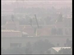 Giant bust of Saddam ready to be removed from top of building News Clip