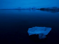 WS T/L View of floating glaciers on Jokulsarlon lake at dawn / Ireland Stock Footage