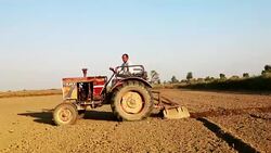 Farmer Tractor & Field working concept Stock Footage