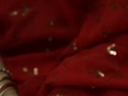 CU TD Woman holding lit candle in bronze candle holder / Singapore Stock Footage