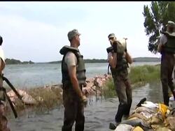 Residents near the swollen Missouri River who live in South Dakota's capital and across the water are hoping levees and thousands of sandbags will protect their homes. News Clip