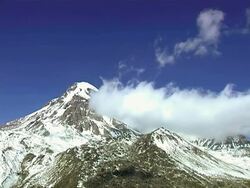 WS T/L View of Caucasus mountains and snowy peaks / Stepantsminda, Kazbegi, Georgia  Stock Footage