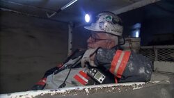 Coal mine train descending into mine News Clip