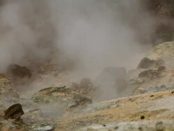 MS Steam rising from rocky ground in Krysuvik Geothermal area / Reykjanes peninsula, Iceland            Stock Footage
