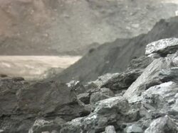 CU Shot of Coal with power shovel circulating / Andorra, Teruel, Spain Stock Footage