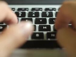 Hand typing a laptop Stock Footage