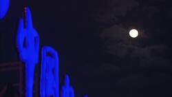 A full moon glows over huge, neon Chinese characters in Shanghai. Stock Footage