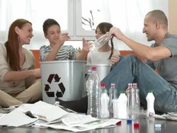 HD DOLLY: Family Having Fun Recycling At Home Stock Footage