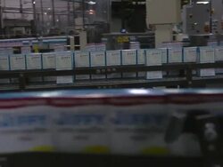 MS PAN Rows of automated lines of baking mix boxes moving to left and right / Chelsea, Michigan, United States Stock Footage