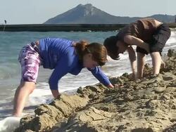 MS Shot of children playing at beach in holiday / Puerto Pollenca, Mallorca, Balearic Islands, Spain Stock Footage