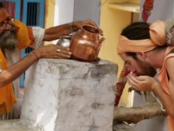 Sage drinking water, Rishikesh, Uttarakhand, India Stock Footage