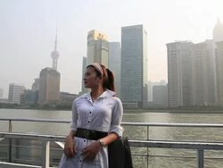 Young woman talking on smart phone on moving ship Stock Footage
