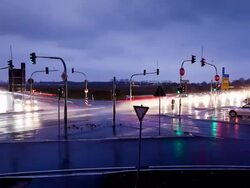 WS T/L View of road intersection with traffic at dusk /Cologne, North Rhine-Westphalia, Germany  Stock Footage