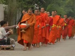 LS Line of monks collecting alms / Luang Prabang, Laos Stock Footage