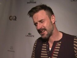 INTERVIEW - David Arquette  loves GQ events and is excited to be in attendance.  He jokes about being the best dressed athlete and shows off his own touchdown dance that would look like a "clown shuffle" Stock Footage