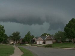 WS View of storm video, dark, scary shelf cloud passing over houses with neighborhood / Grapevine, Texas, United States Stock Footage