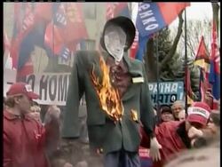 Several thousand people rally outside the U.S. Embassy in the Ukraine, ahead of a visit by President Bush. They burned an effigy of Bush, shouting for Bush to get out and not pull the country into NATO, the North Atlantic Treaty Organization Instructional Video