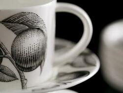 ECU PAN Cup and saucer placed in black backdrop / Seoul, South Korea Stock Footage