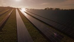 AERIAL Solar Power Station In The Evening Sun (4K/UHD) Stock Footage