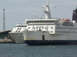 WS Ferry ship crossing on river Warnow, shipyard / Warnemuende near Rostock, Mecklenburg-Western Pomerania, Germany Stock Footage