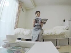 Woman reading a magazine in room Stock Footage