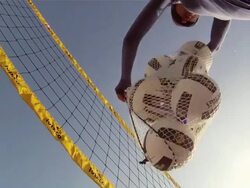 POV LA WS of female beach volleyball player dumping all the volleyballs out onto the camera. Stock Footage