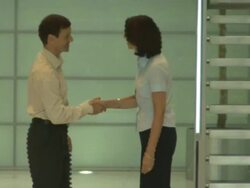 Man and woman meet and shake hands, UK Stock Footage