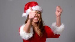 Cute girl in santa costume turning to camera Stock Footage