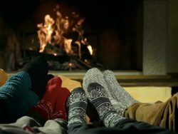 HD DOLLY: Feet Warming At Fireplace Stock Footage