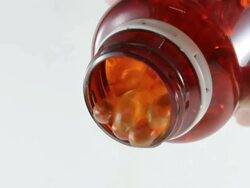 Pouring capsul oil fish from bottle Stock Footage