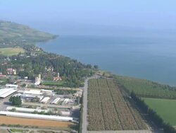 Aerial the Sea of Galilee, also known as Lake of Gennesaret, Lake Kinneret, Sea of Tiberias or Tiberias Lake, Israel Stock Footage