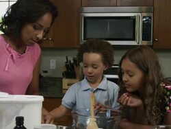 Slow motion of mother pouring flour. Stock Footage