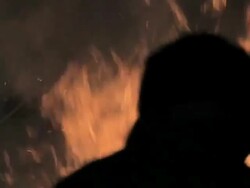 M-L/S Horses and riders crossig close to a big bonfire Stock Footage