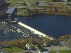 MS AERIAL TS View of small Dam at Howland / Maine, United States Stock Footage