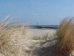 Lighthouse in the dunes Stock Footage