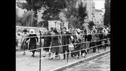 CAN403 CHRISTIANS AT MANDELBAUM GATE CROSS FROM JORDAN INTO JERUSALEM News Clip