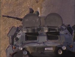Troops on foot patrol, search for mines, helicopter Instructional Video