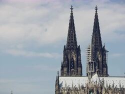 MS Shot of two towers top part of Cologne Cathedral peaks under blue sky / Cologne, North Rhine-Westphalia, Germany Stock Footage