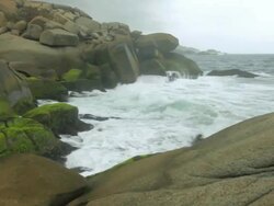 MS PAN Shot of large rocks by sea side / Tyrona N. Park, Magdalena, Colombia  Stock Footage