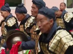 LS CU People performing gongs with costumes/xian,shaanxi,China Stock Footage