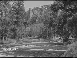 1939: CALIFORNIA PARKS: WS Yosemite Falls (Cholock) in Yosemite National Park. Angled WS River w/ Sierra Nevada Mountains BG. WS People on trail. XWS Mount Whitney, Sequoia National Park. XWS Death Valley. Zabriskie Point, convoluted rock formation. Instructional Video