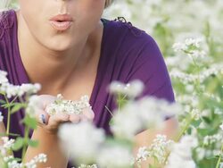 HD SLOW-MOTION: Woman Blowing The Buckwheat Stock Footage