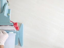 Dolly: Worker using Thermal Impulse  Sealer to seal Food Package Stock Footage