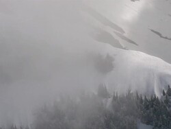 AERIAL WS POV View of trees on snow mountains / Montana, United States Stock Footage