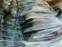 MS TU View of Volcanic Rock stratum in Yongmeori Dragonhead Coast / Seogwipo, Jeju-do, South Korea Stock Footage